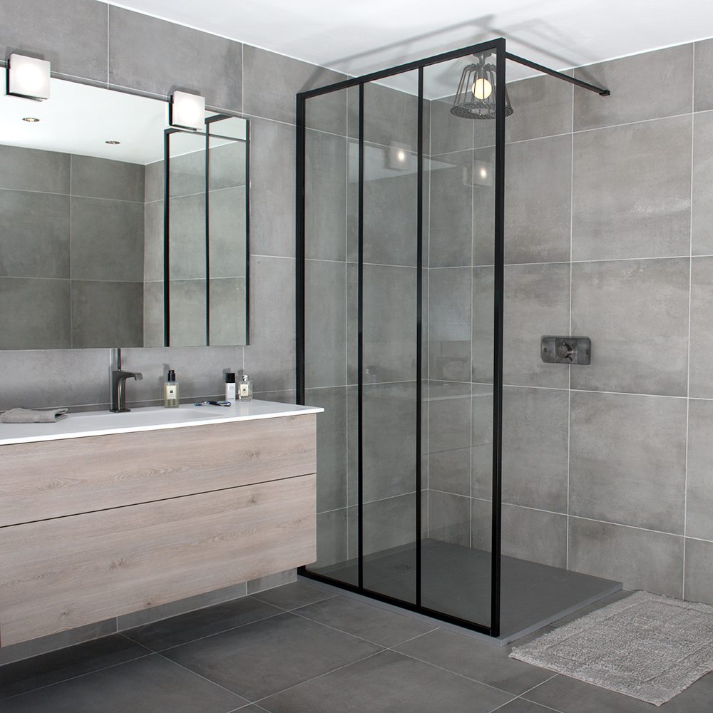 A black art deco inspired LINEA framed shower screen with vertical glazing bars by Drench