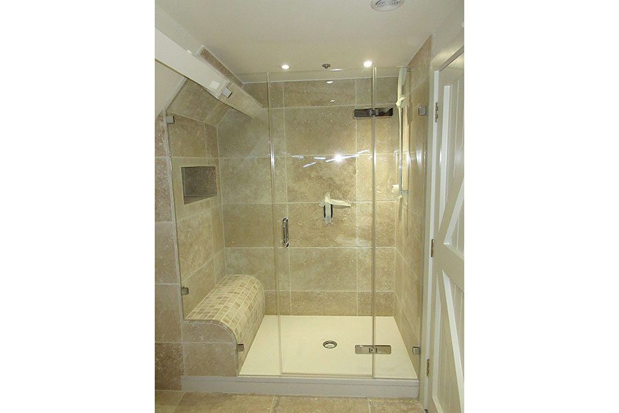 Bespoke glass shower with tray and tiled shower seat by Room H2o