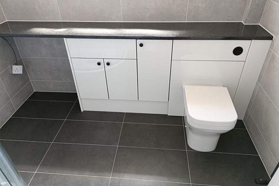 Roper Rhodes white gloss fitted bathroom furniture installed by Room H2o for a customer in Carey Dorset