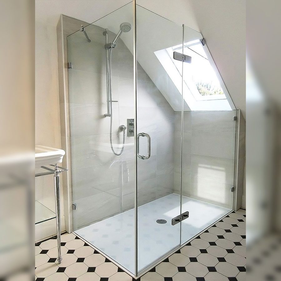Large angled frameless shower enclosure in a loft conversion