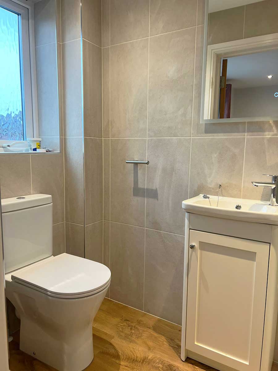 A completed shower room in a flat in Swanage Dorset by Room H2o